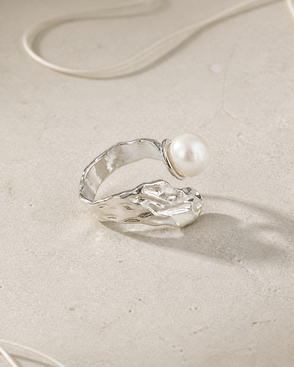 Silver Wing Pearl Ring — 4:5 styled product photograph
