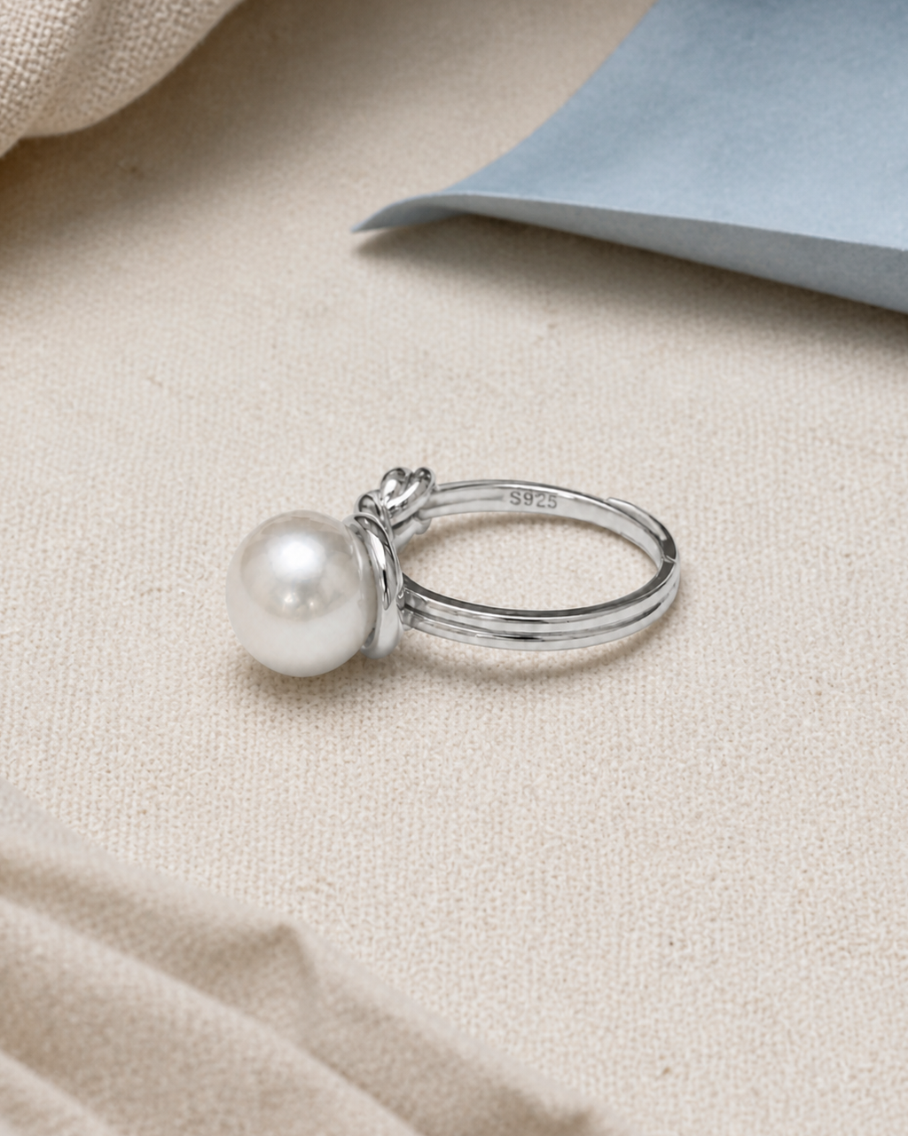 Sterling Loop Pearl Ring — 4:5 styled product photograph