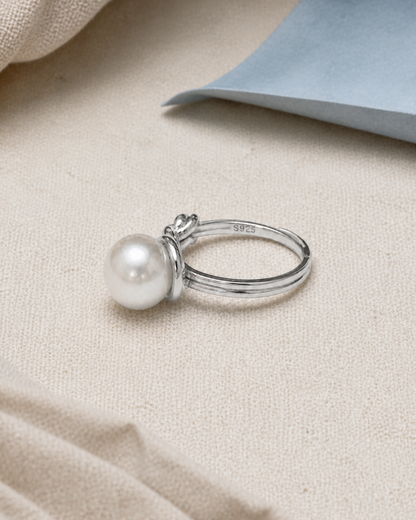 Sterling Loop Pearl Ring — 4:5 styled product photograph