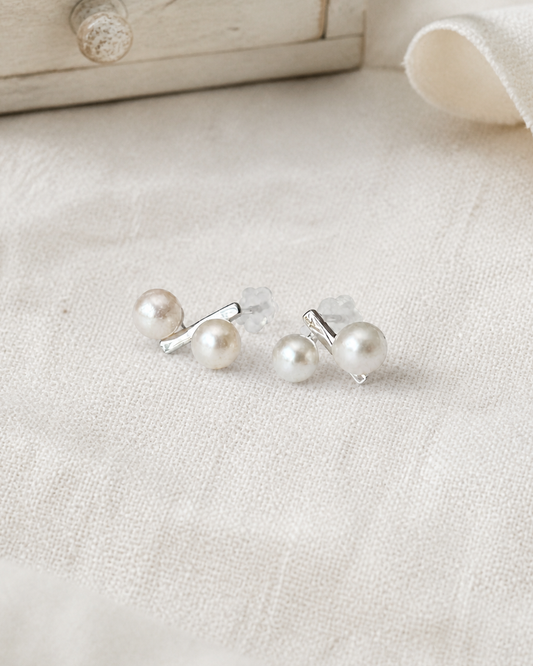 Parallel Pearl Bar Studs — 4:5 styled product photograph