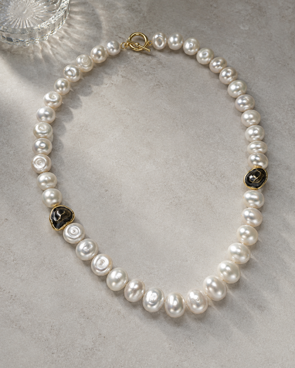 Luminous Baroque Pearl Necklace with Gilded Accents — styled product photo