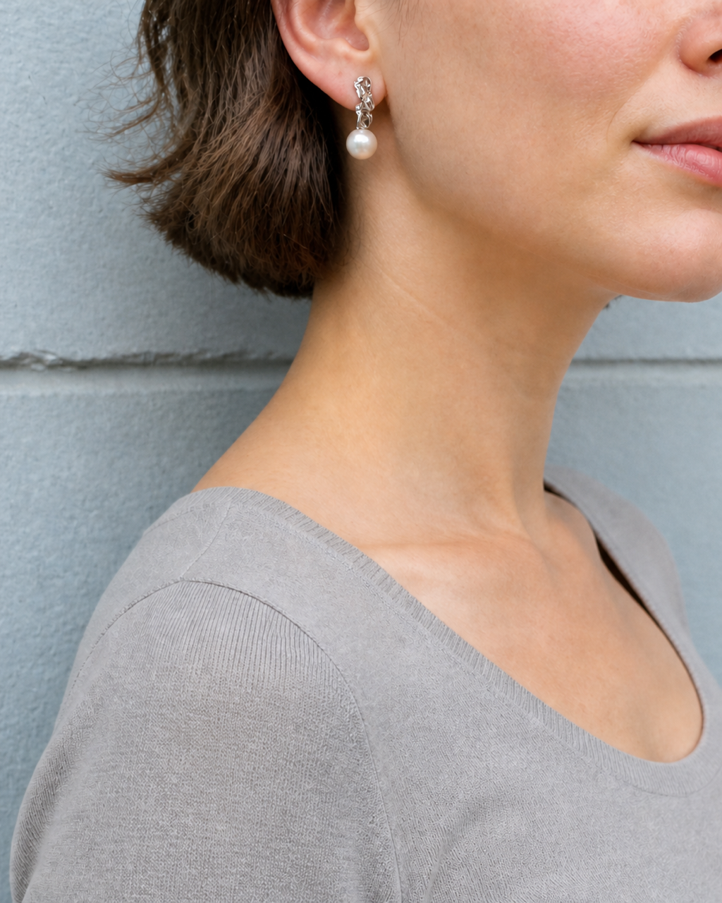 Molten Silver Pearl Drop Studs — 4:5 try-on showing the stud worn directly through the earlobe