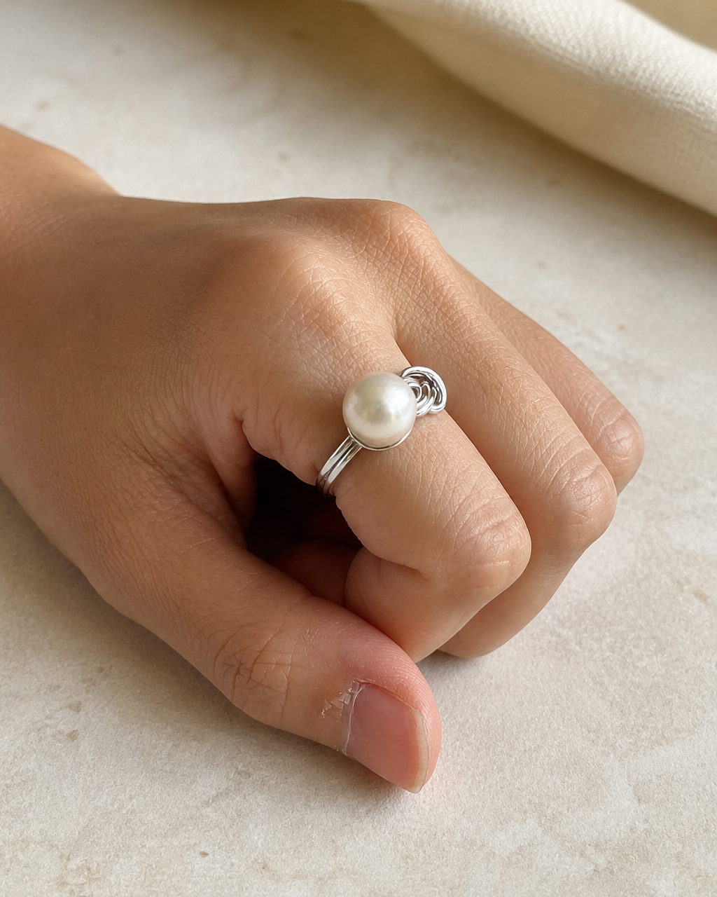 Sterling Loop Pearl Ring — 4:5 try-on photograph