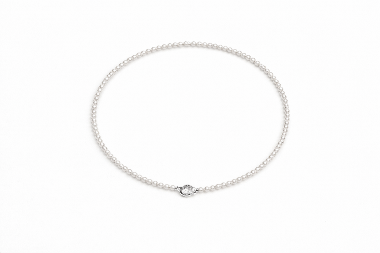 Silver chain necklace on a white background
