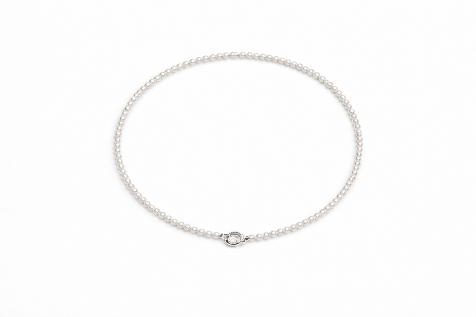 Silver chain necklace on a white background