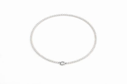 Silver chain necklace on a white background